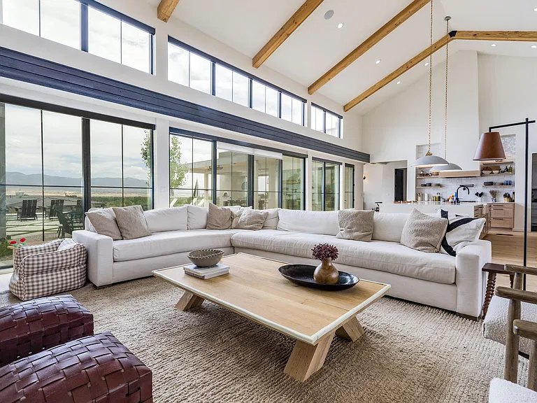 Vaulted great room with timber beams and clerestory windows in a Corrales, NM custom home by Infinity Builders