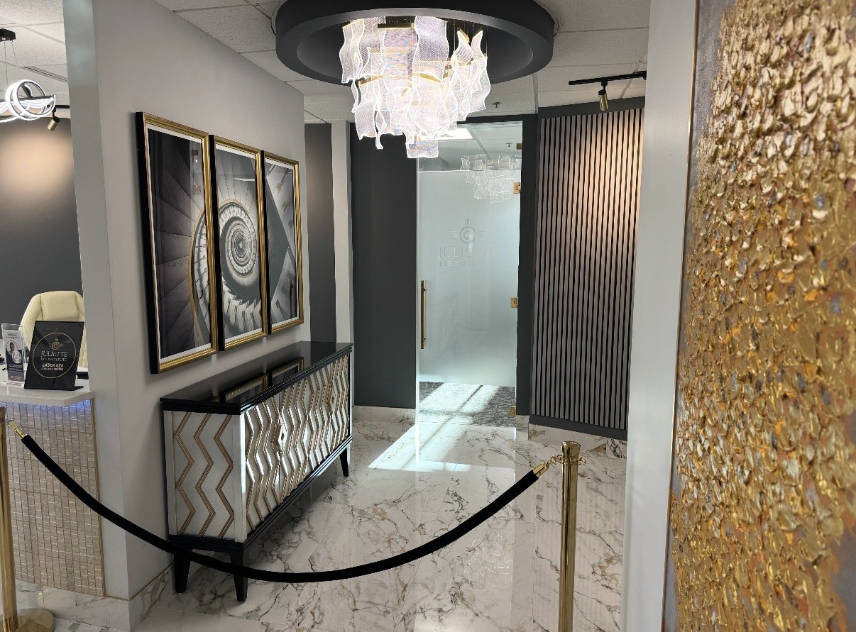 Eye doctor’s office entry hallway with chandelier and gold accents, built by Infinity Builders in New Mexico
